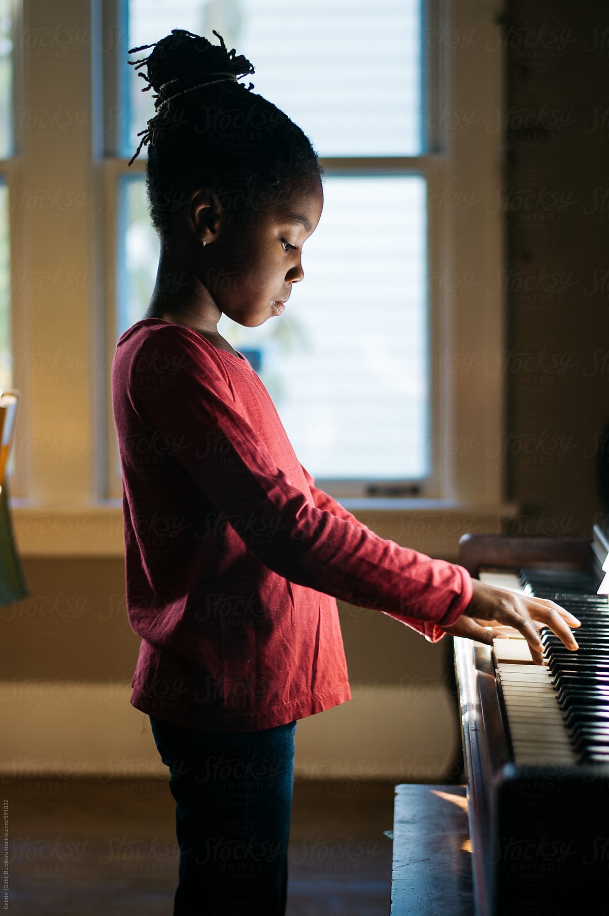 little black girl playing piano