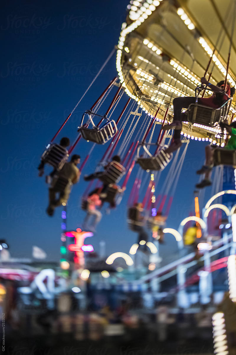 People having fun on swing Carousel