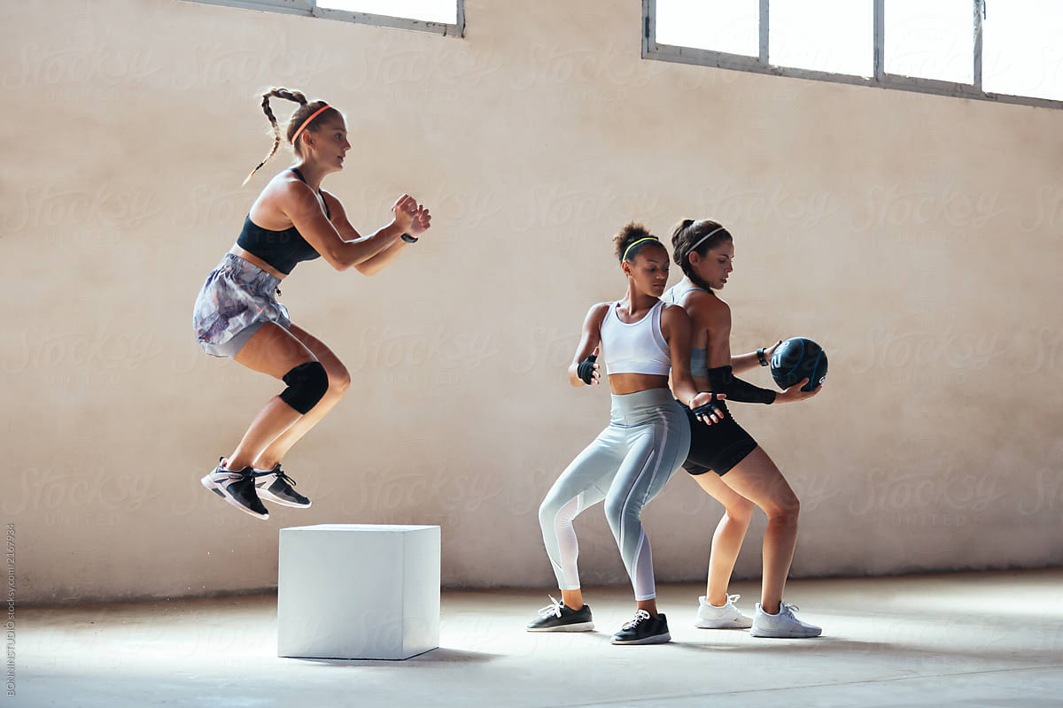 Young women working out indoors.
