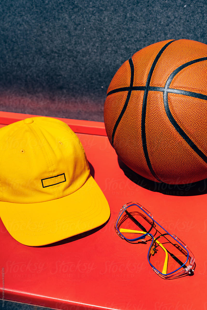 Still life photography of basketball, cap， sunglasses