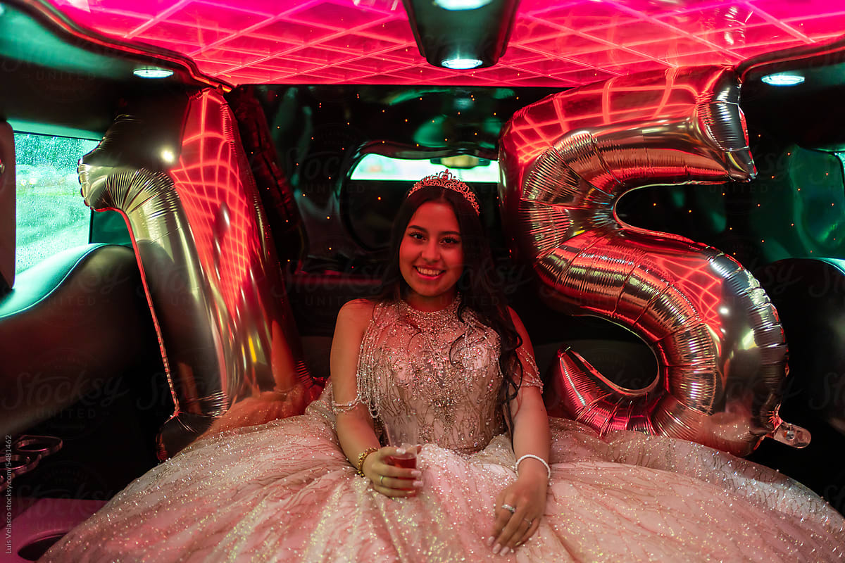Portrait Of A Happy Quinceanera Girl\'s Birthday Party In A Limousine.