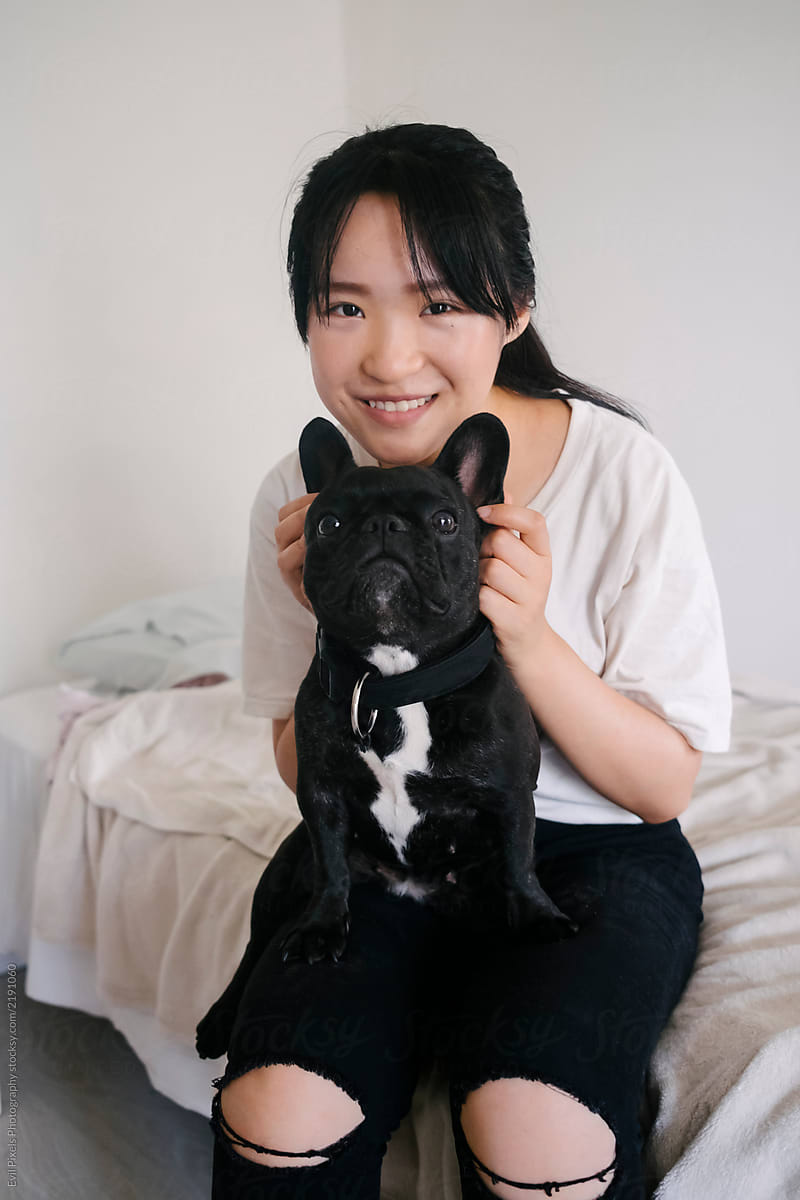 Chinese Girl With Her Dog On Her Lap