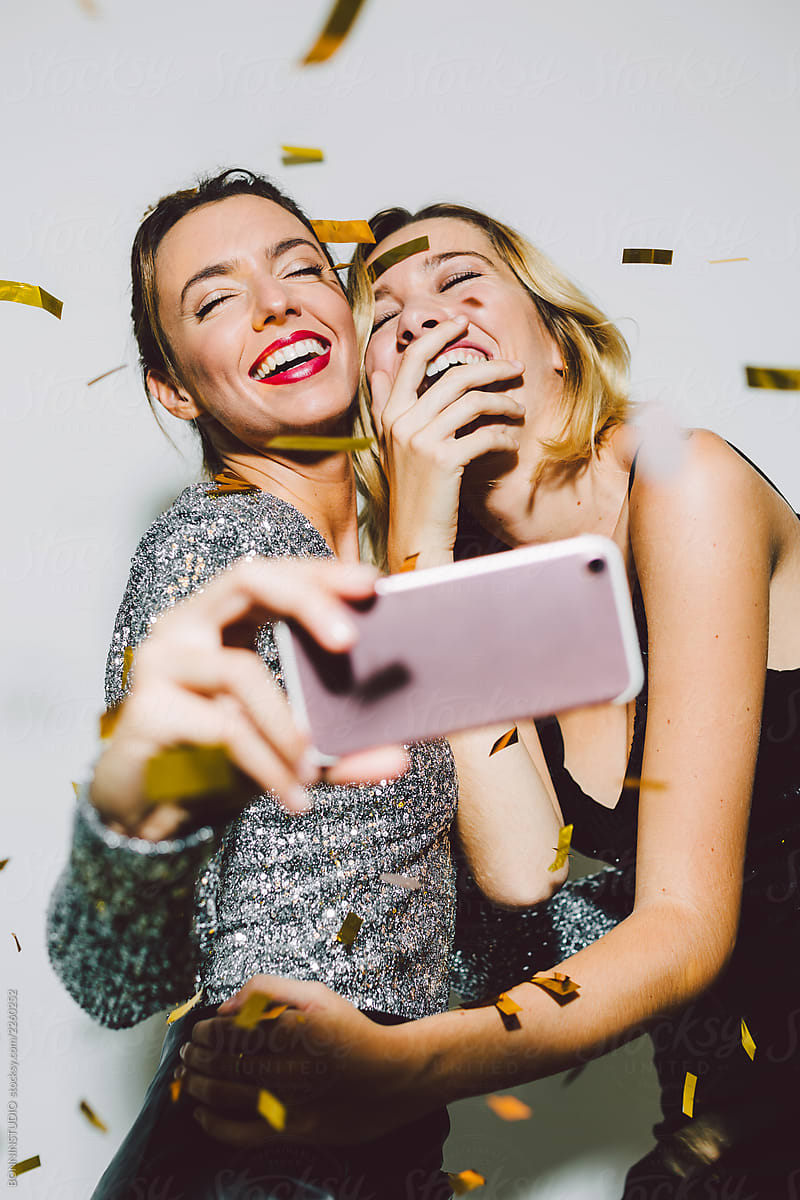 Beautiful Laughing Women Taking A Selfie In A New Year Party 