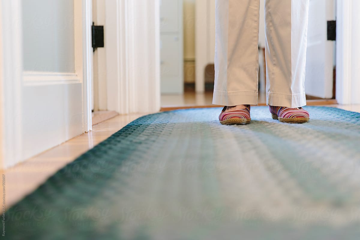 "Senior Woman In Hallway Of Home With Cozy Slippers" by Stocksy ...