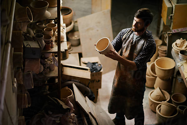 Stylish pottery molding a vase of clay on a potters wheel. Handmade. Stock  Photo by ©Stop war in Ukraine! 421497760