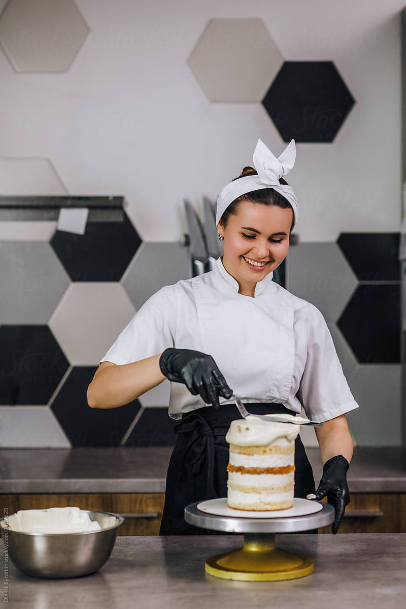 Woman preparing creme cake