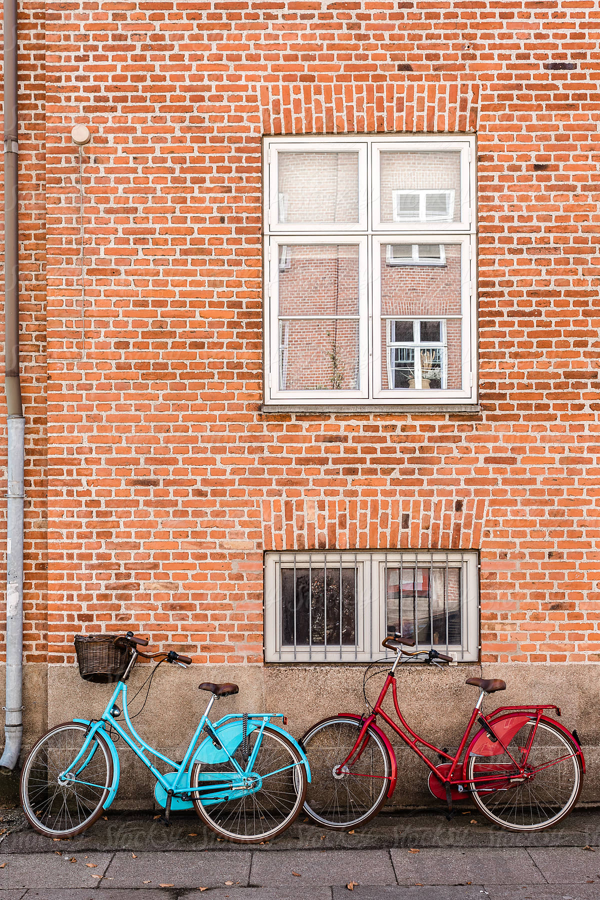 Parked bikes in front of house wall