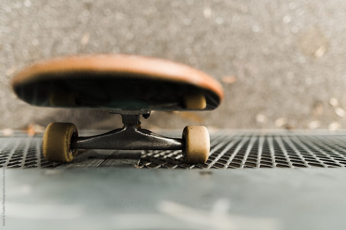 Skateboard leaning against wall