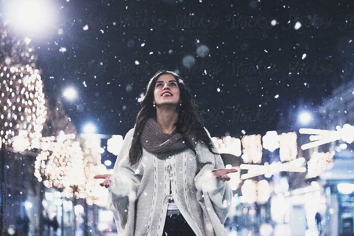 Girl is happy because is snowing