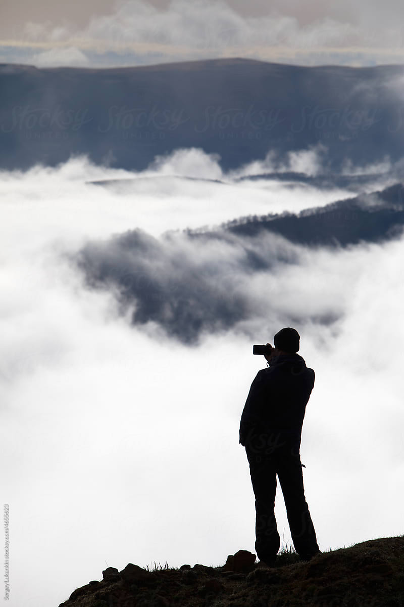 Silhouette of a man on a background of mountains