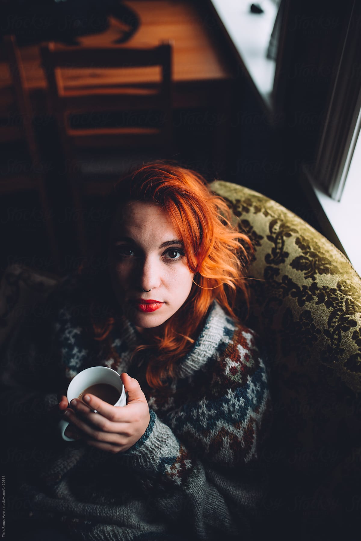 ginger woman having a cup of coffee