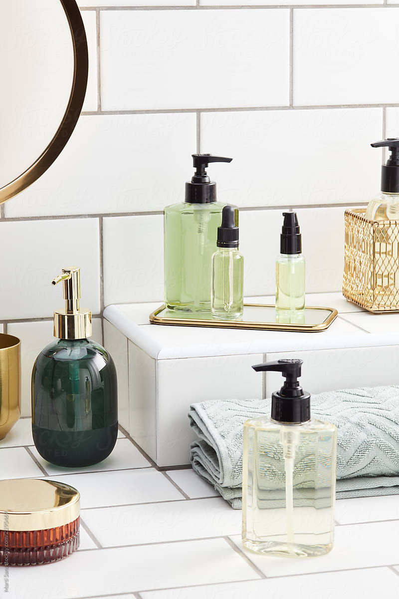 Bath white shelf with various beauty bottles