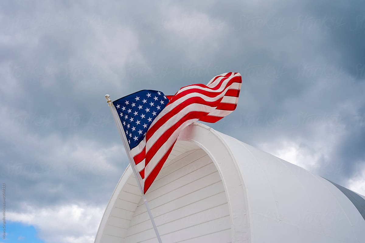 American Flag on cloudy sky