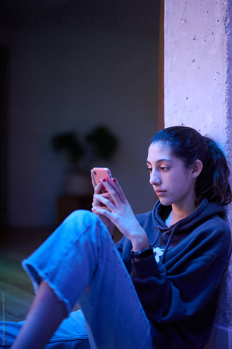 Relaxed teen with smartphone