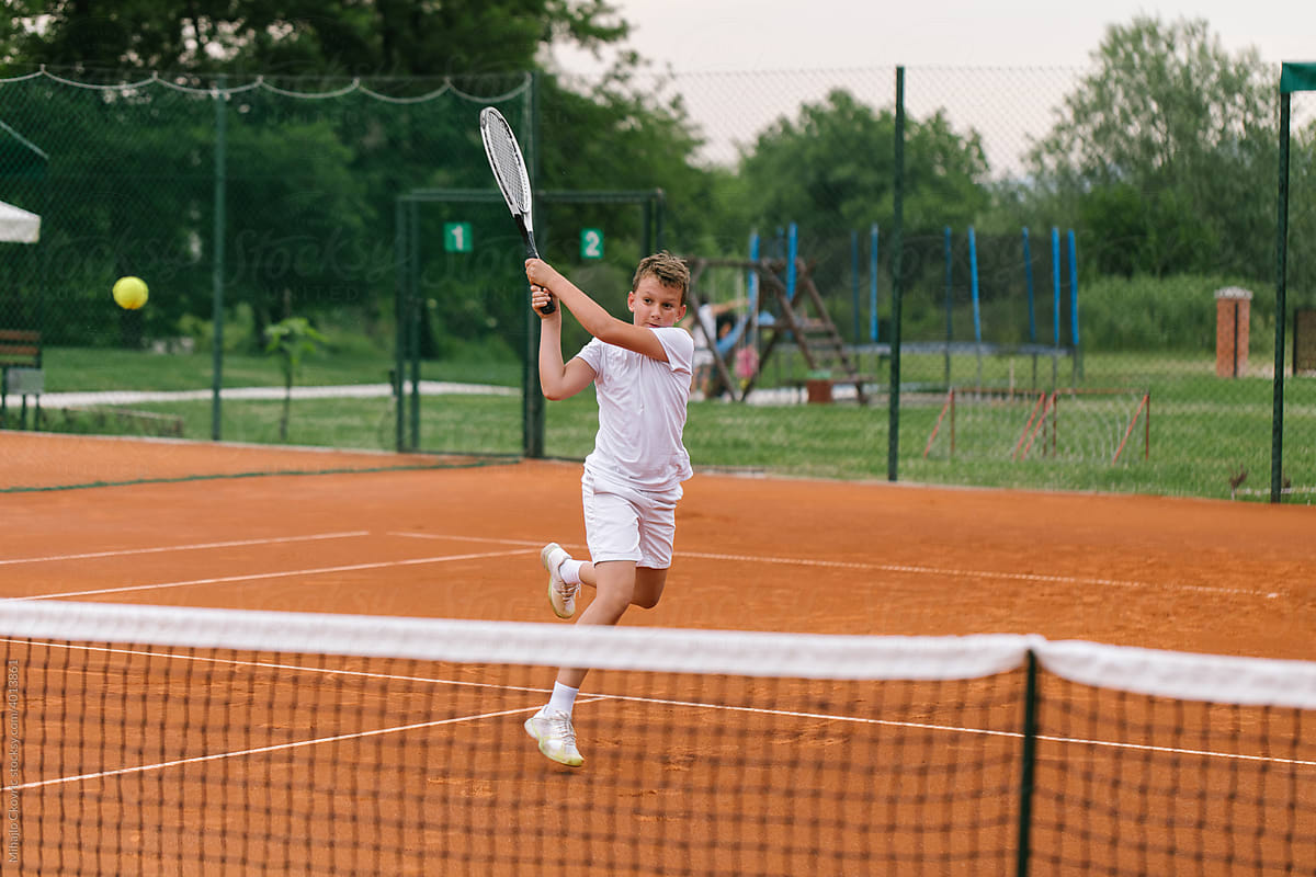 Kid Participating In A Tennis Competition