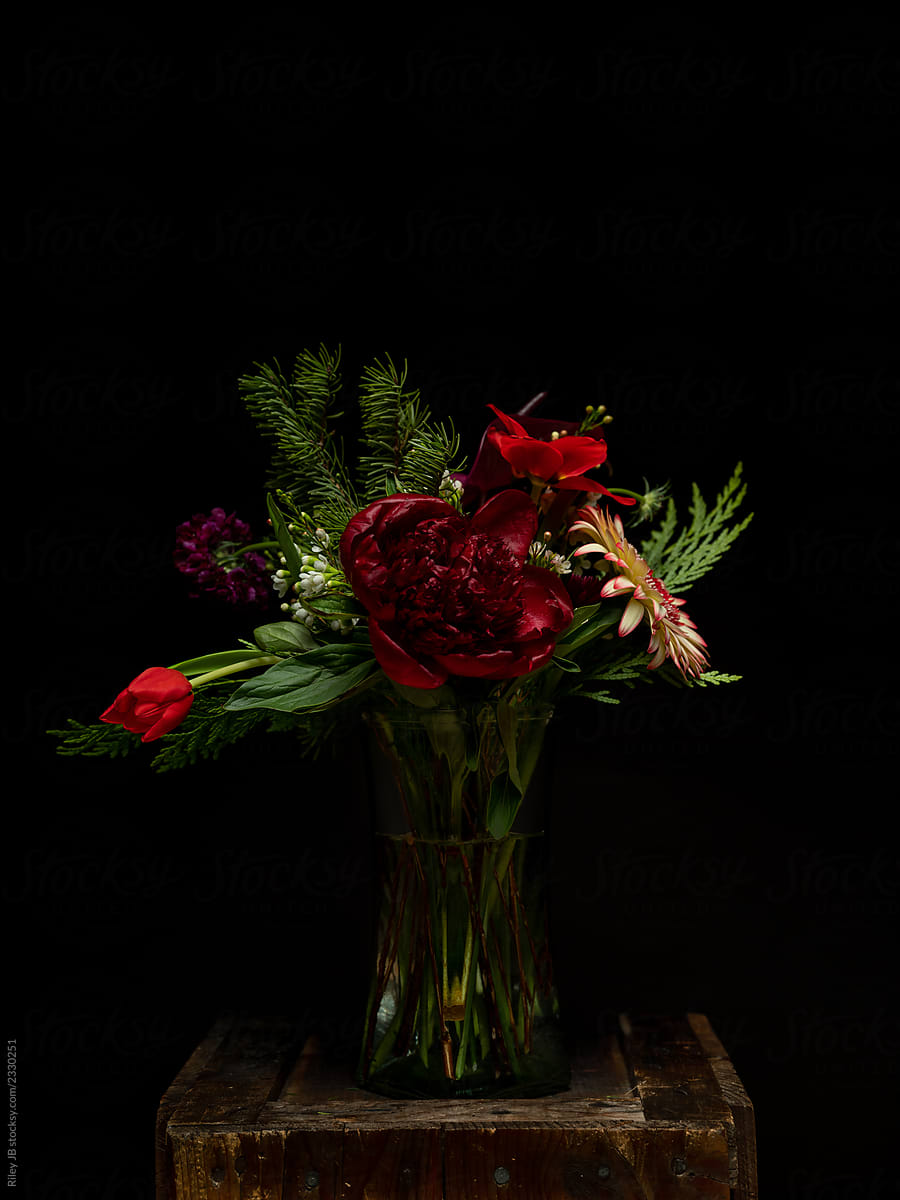 A beautiful flower arrangement in a dark & moody setting.