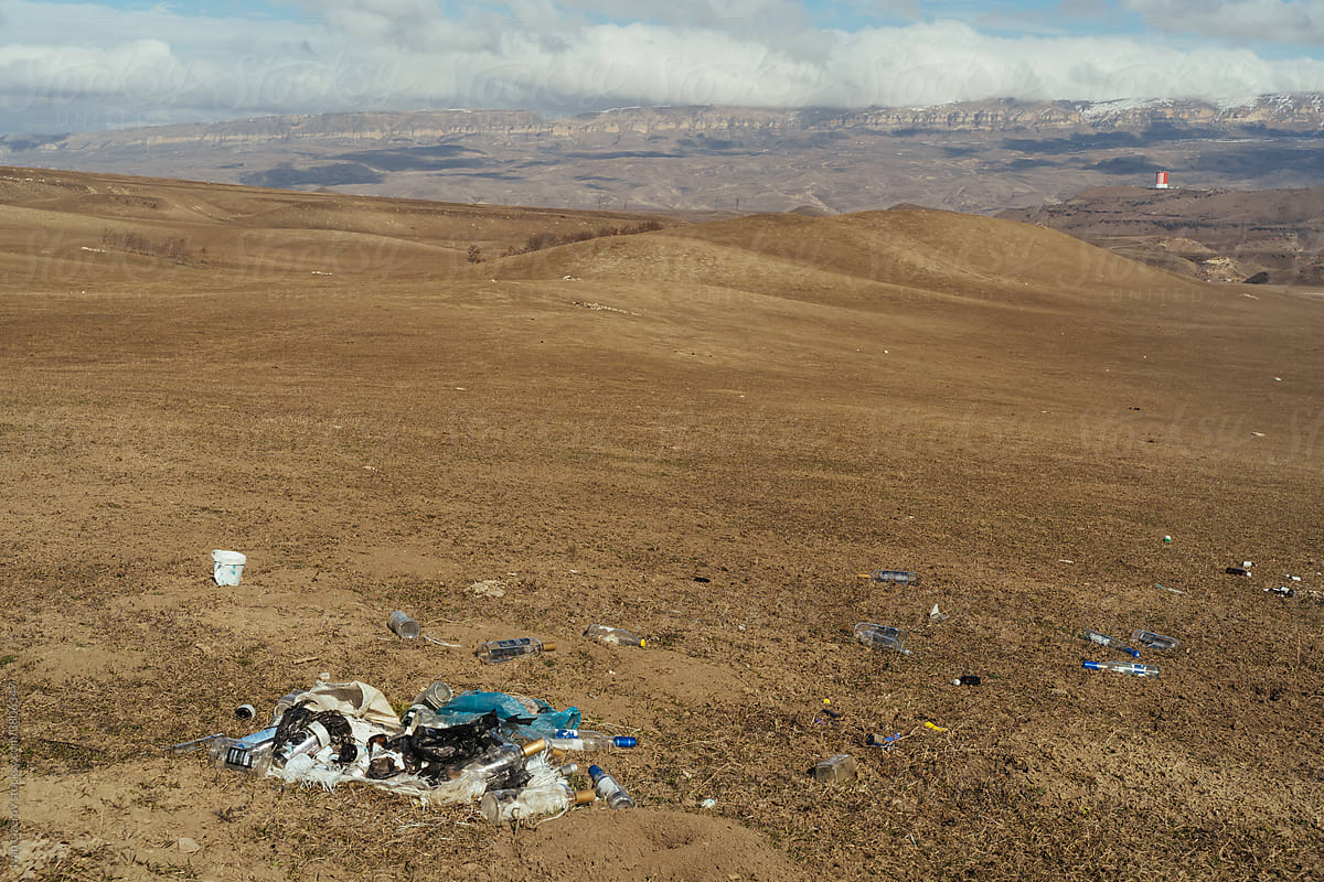 Trash on grassy hill in highlands