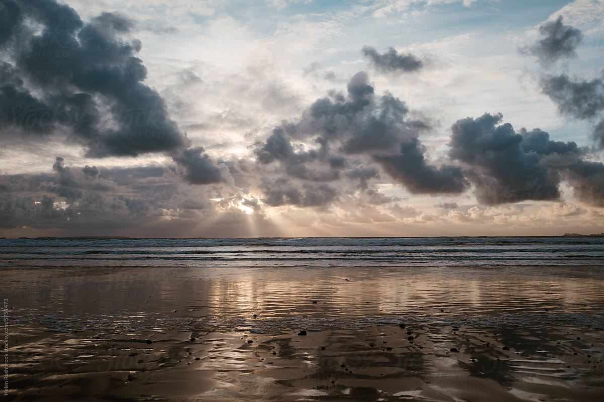 A dramatic cloudy sunset sky on the coast in winter.
