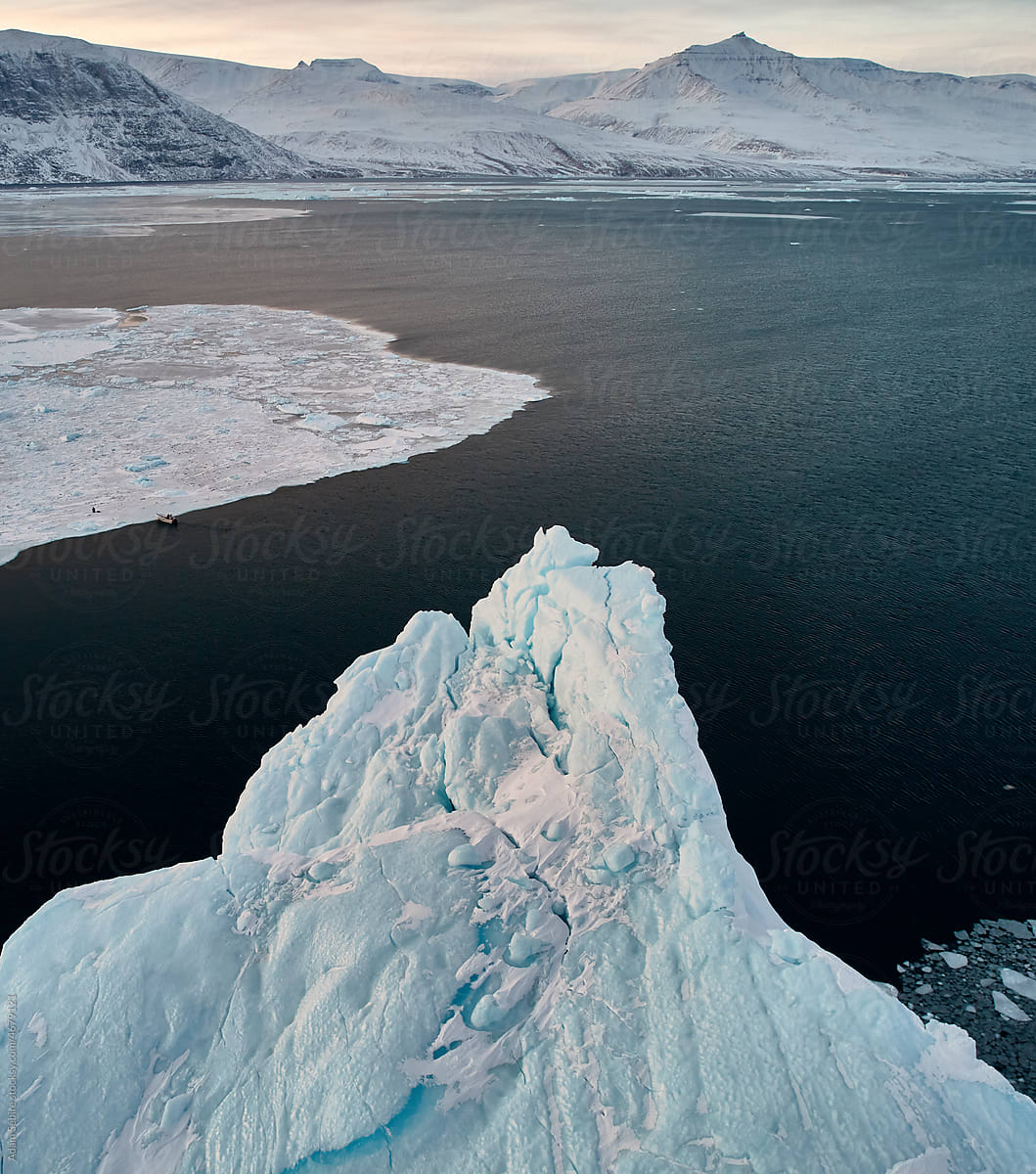 Greenland Arctic iceberg in winter - majestic large berg, ice peak tip