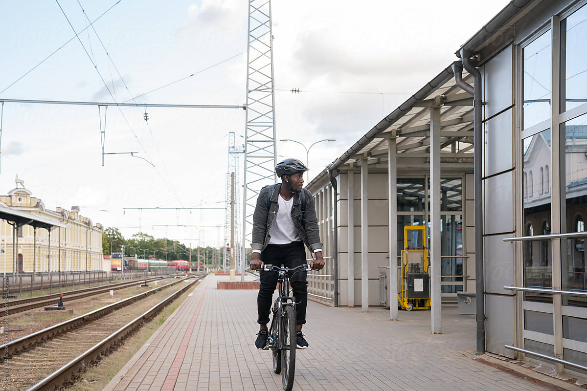 Man Riding Bicycle In Train Station
