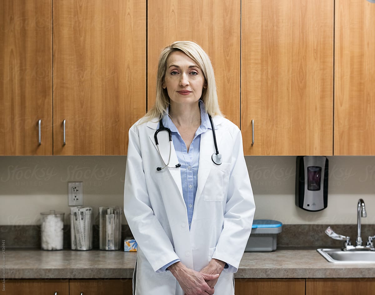 Clinic: Female Doctor Looking At Camera