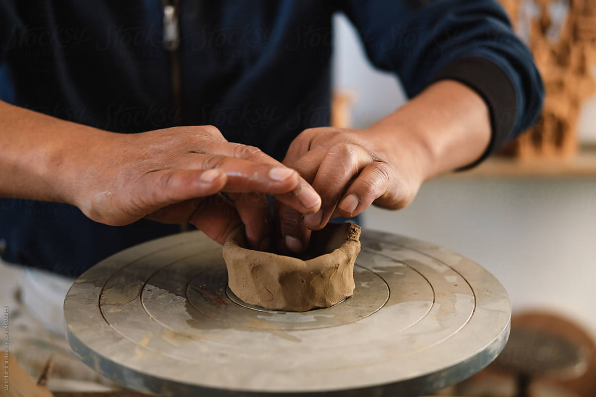 closeup of Artisan  hands Shaping a piece of clay
