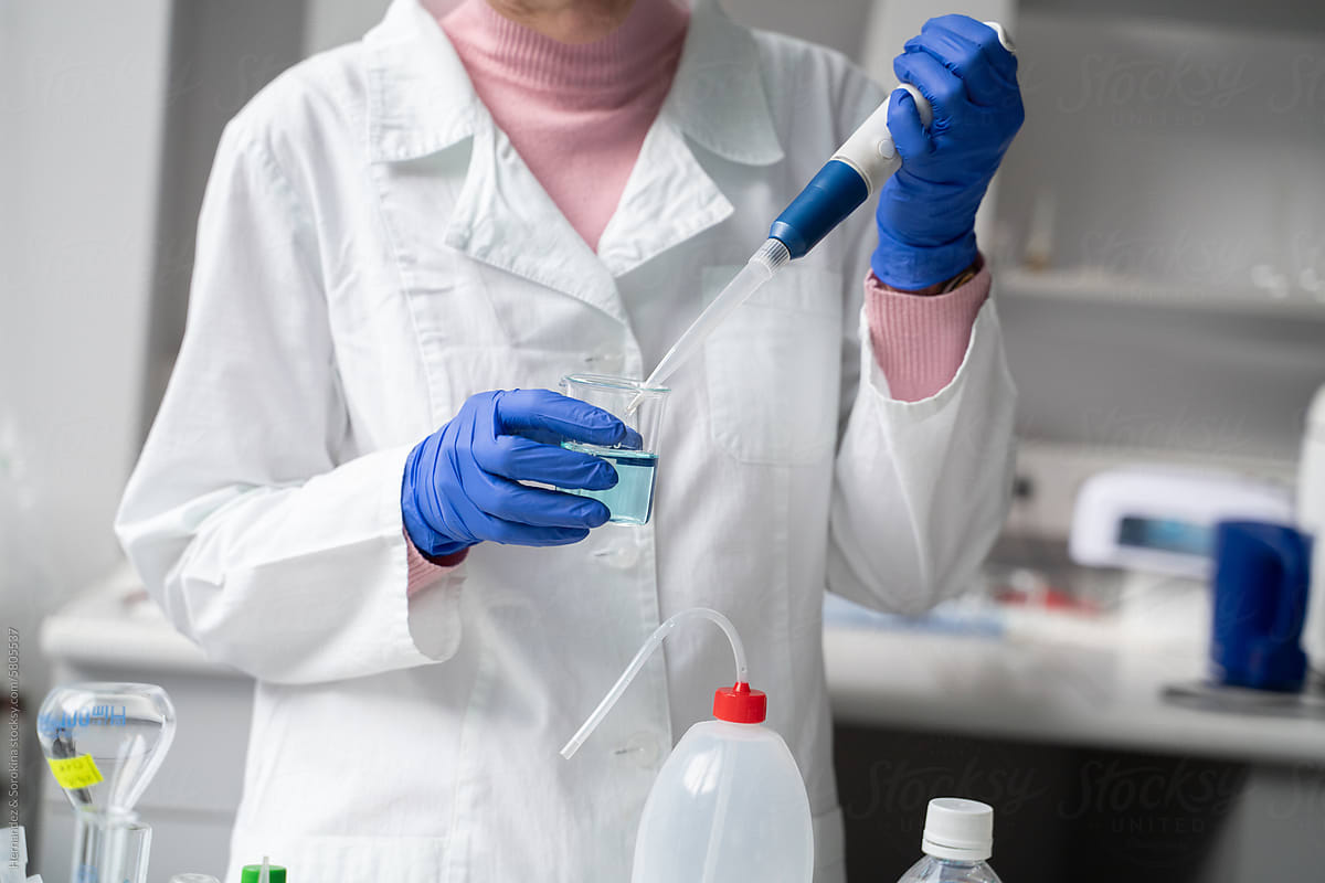 Anonymous Researcher Holding Pipette In The Lab