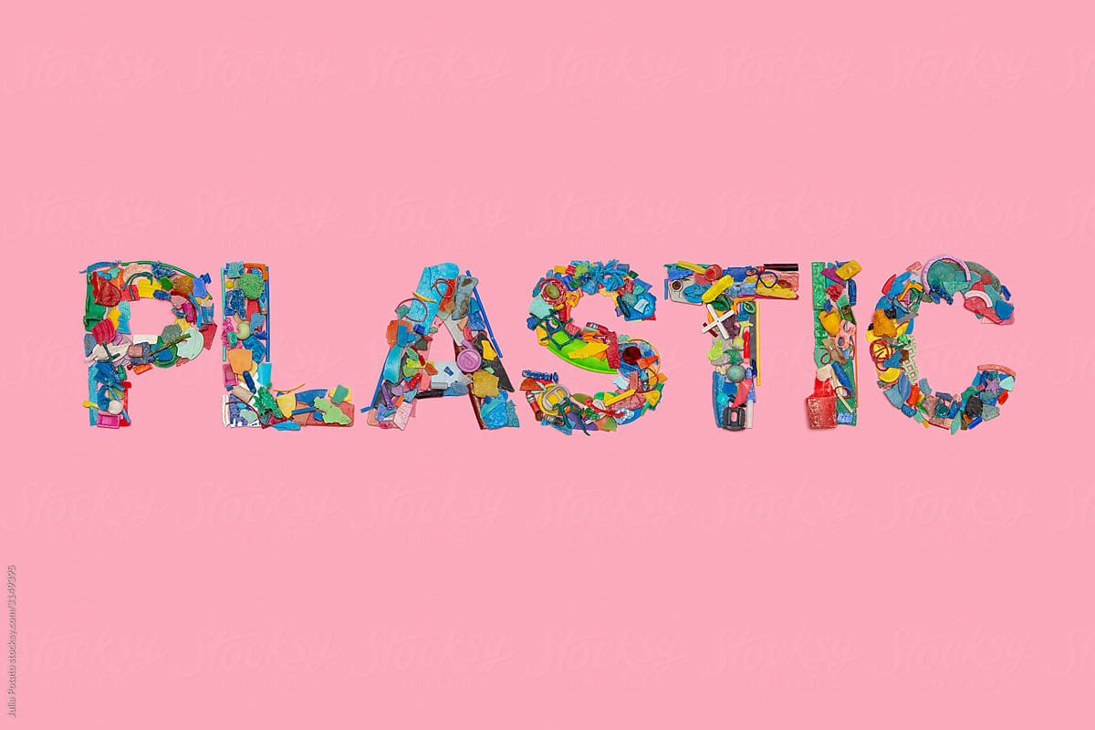 Pieces of colourful plastic in form of word PLASTIC