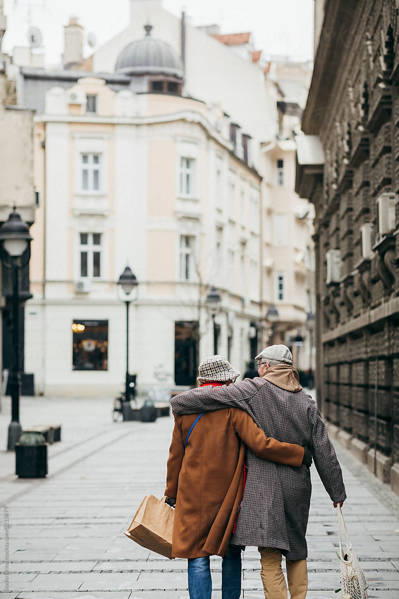 Senior Man and Woman Walking in City