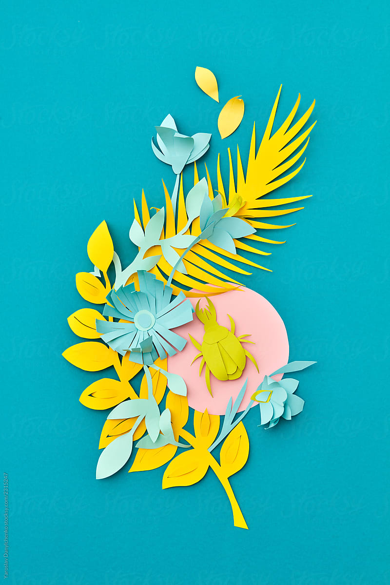 Creative composition of paper craft with tropical leaves