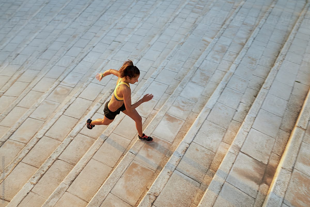 Active Runner On Steps In Motion By Stocksy Contributor Guille Faingold Stocksy
