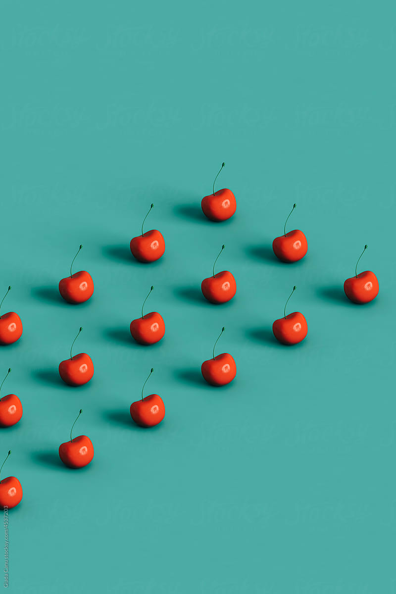 collection of cherries on blue background