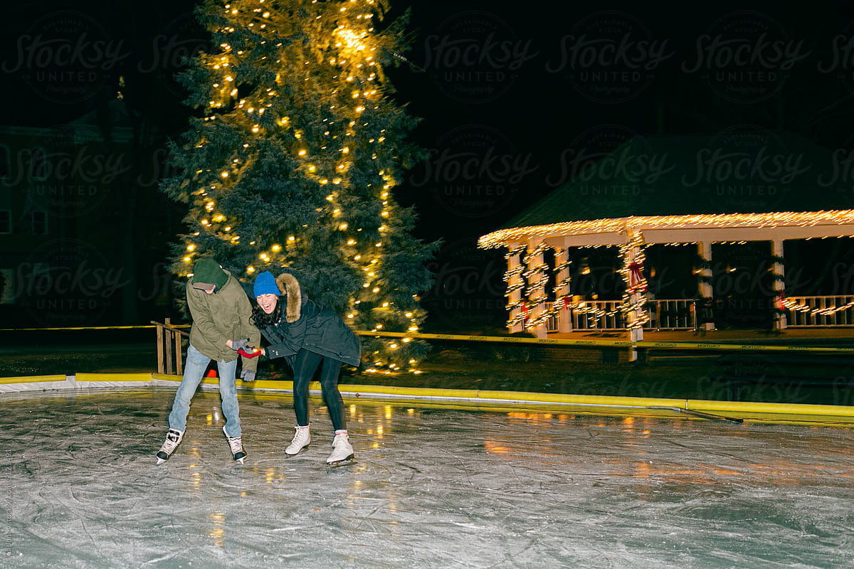 UGC happy young people skating at night time