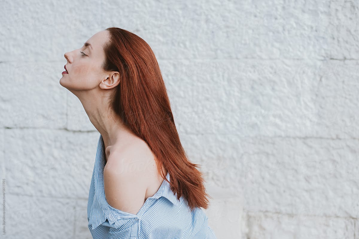 Profile Of A Woman With Beautiful Long Neck by Stocksy
