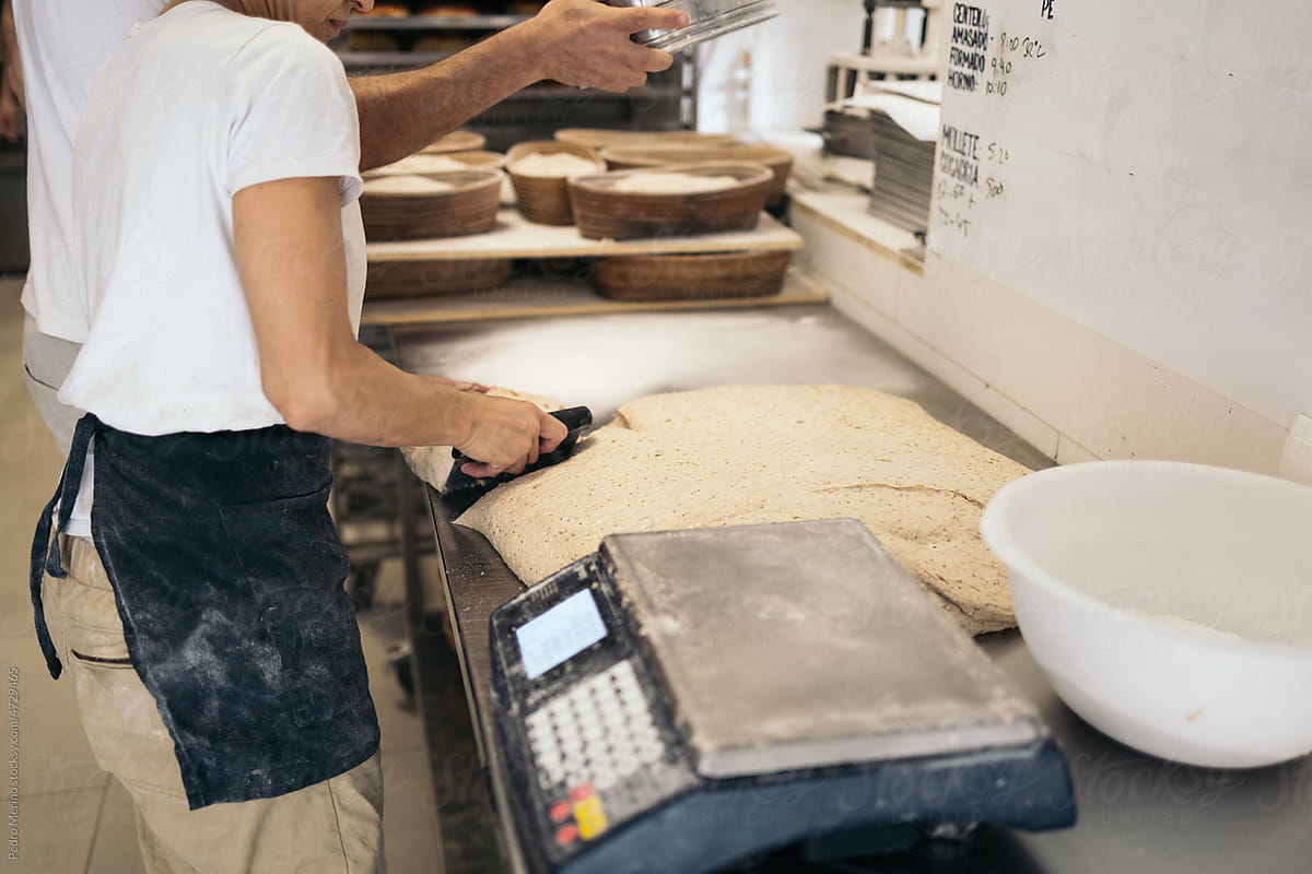 Baker Preparing The Dough For The Bread Making