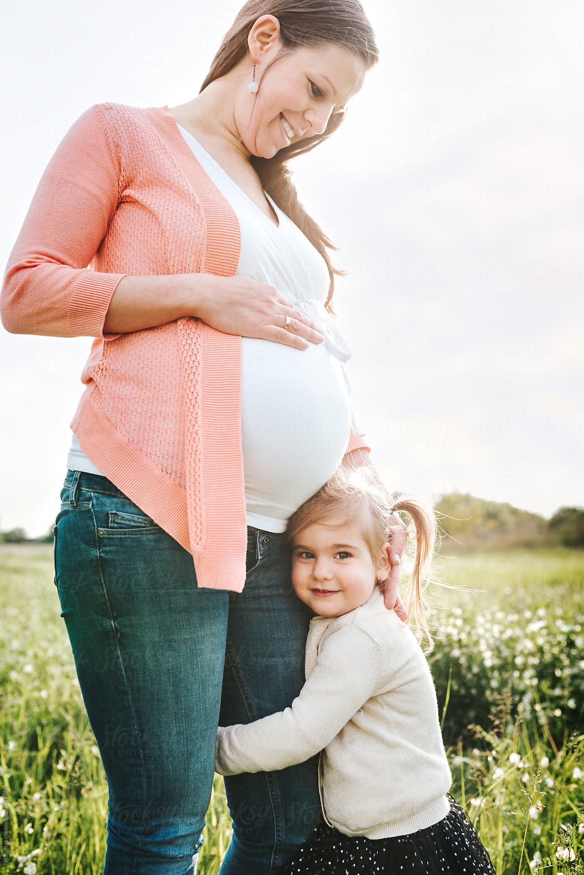 Daughter Hugging Her Pregnant Mother By Stocksy Contributor Lea Csontos Stocksy