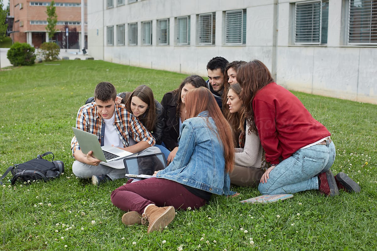 Group of students watching a video in university campus