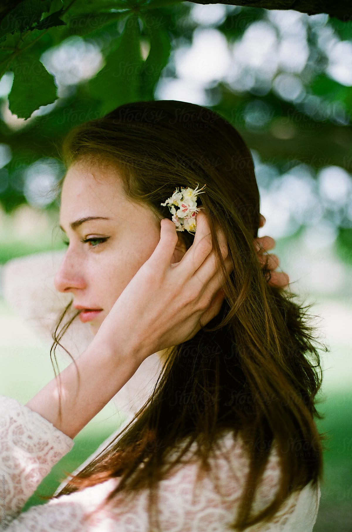 Portrait Of Beautiful Woman With Flower On Her Hair Del Colaborador De Stocksy Amor Burakova 