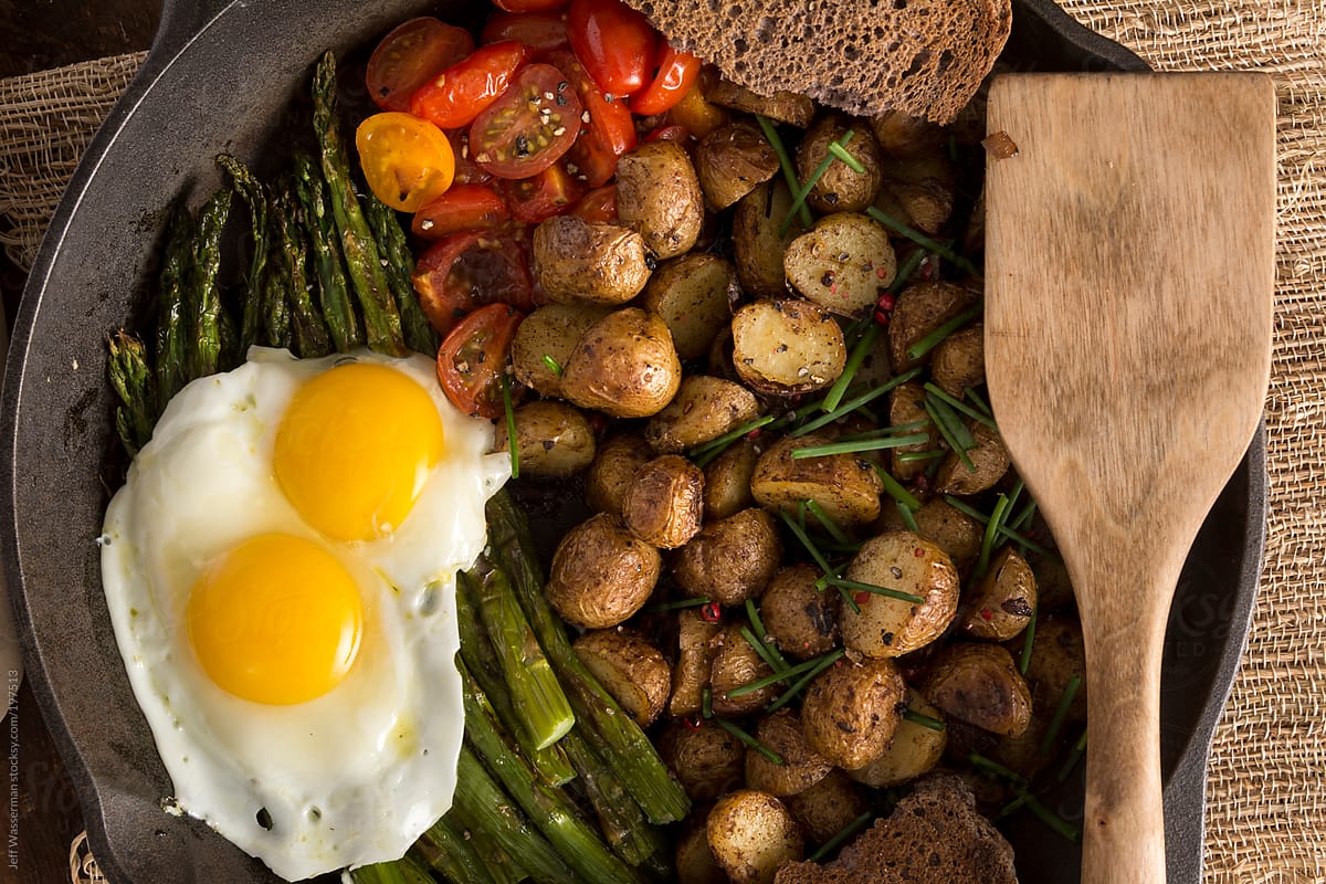 Breakfast:  Fried Eggs on Grilled Asparagus, Potatoes and Cherry Tomatoes