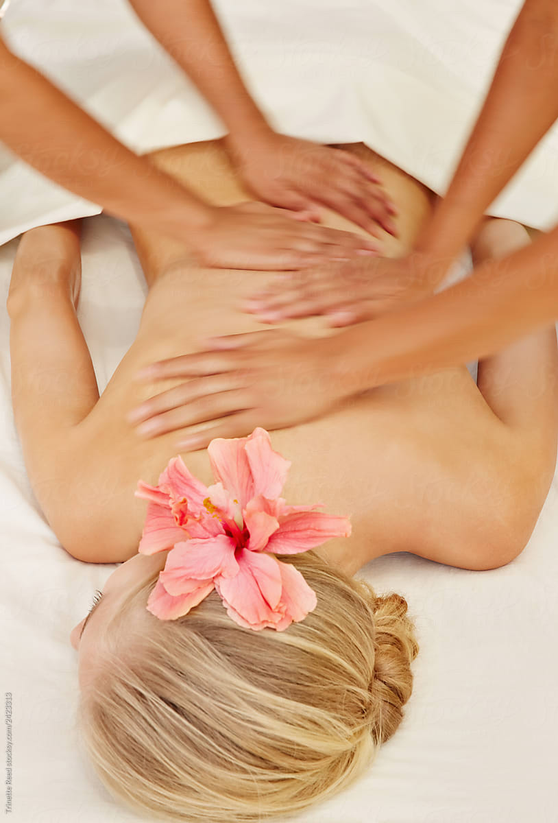Woman receiving a four handed massage