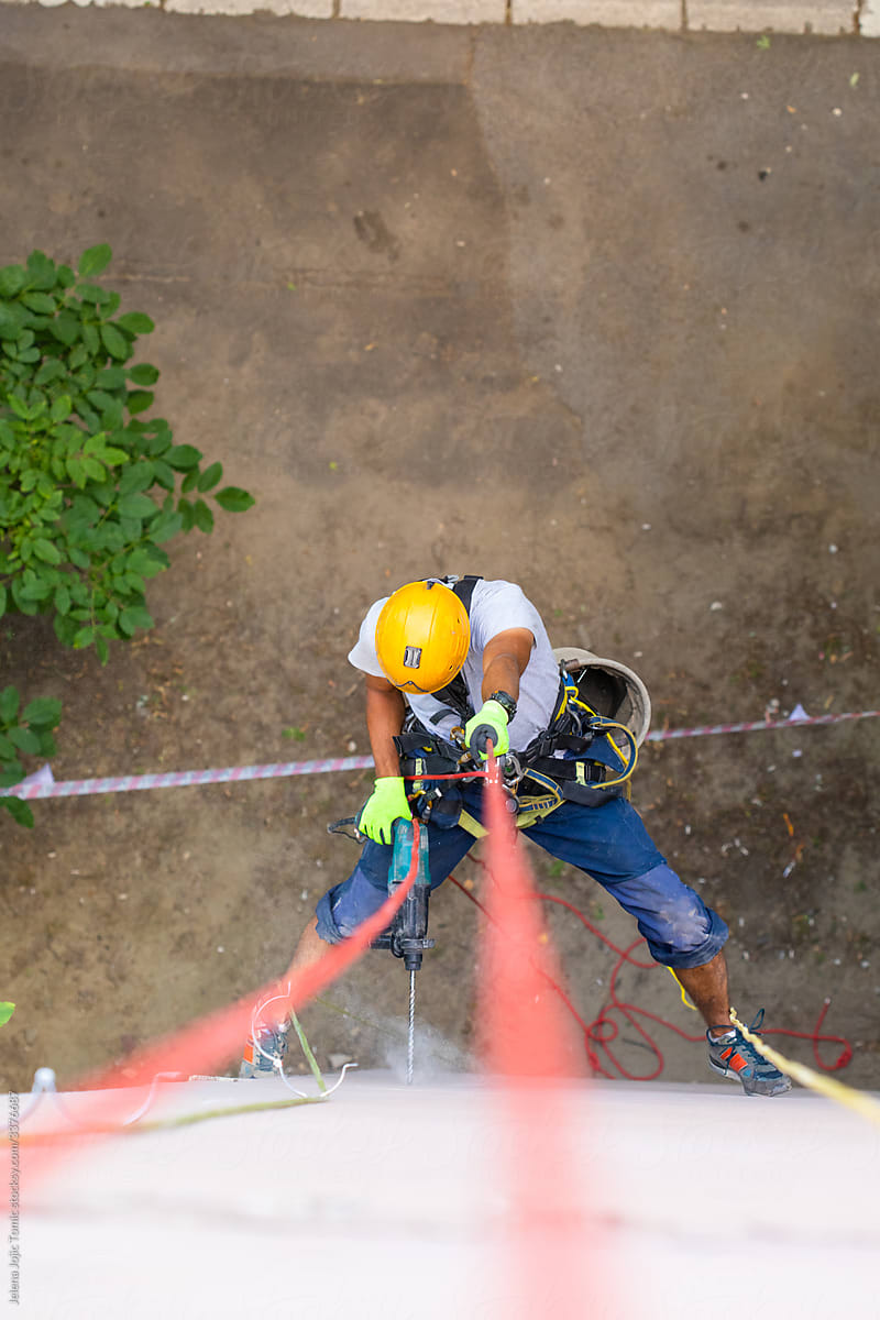 Working at elevations. Rope access, high-altitude outdoor work.