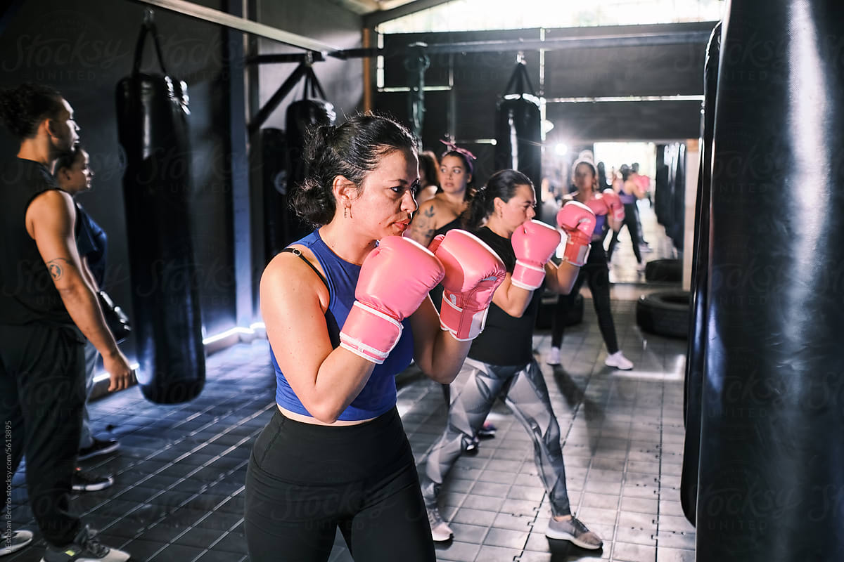 Women boxing in a gym