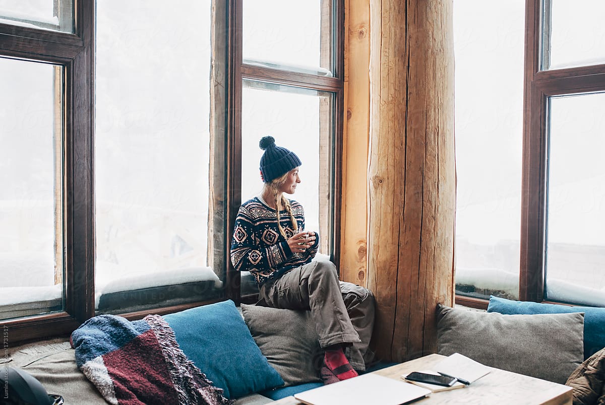 Woman Enjoying Tea in Ski Lodge