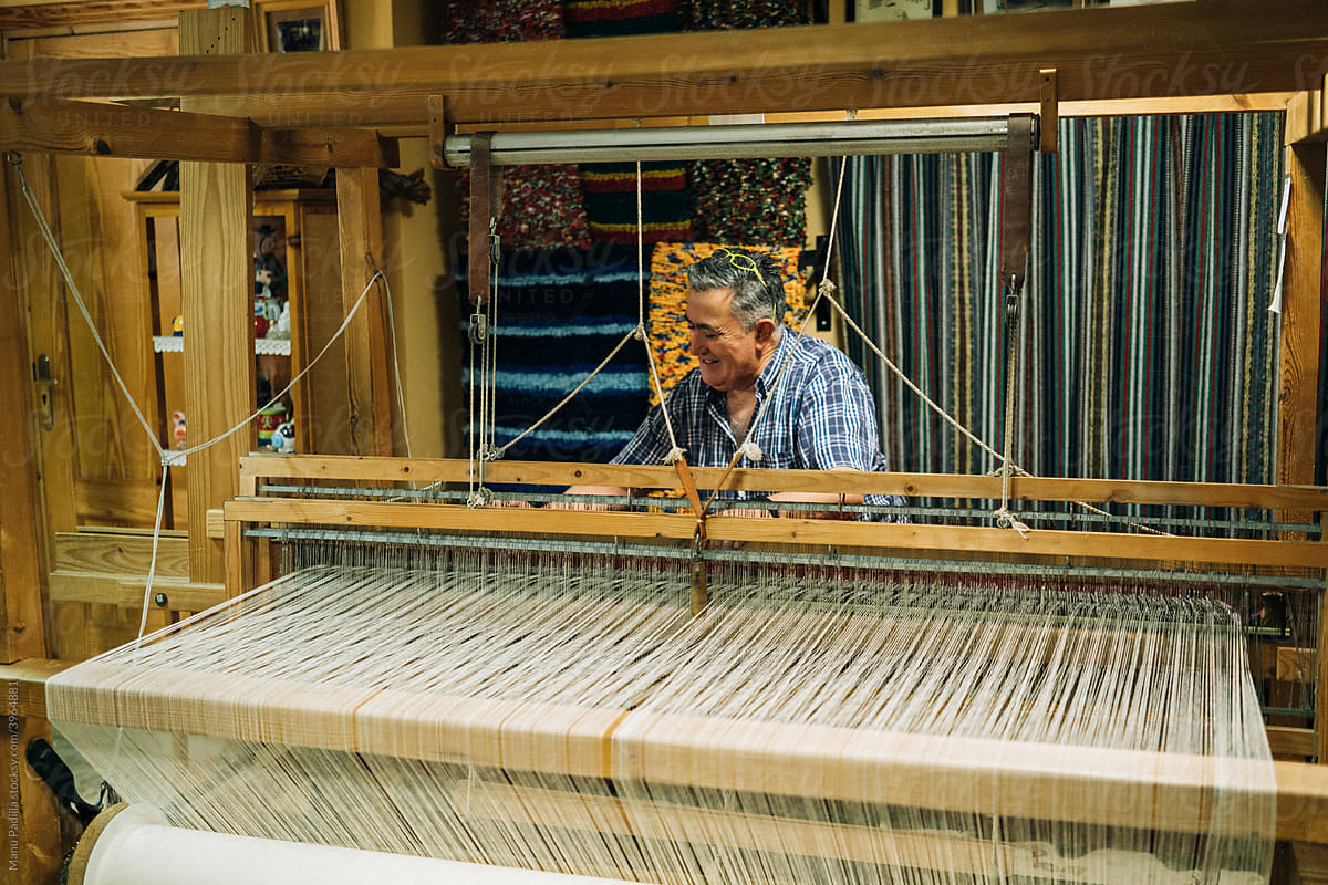 A Craftsman Prepare the Warp in the Loom