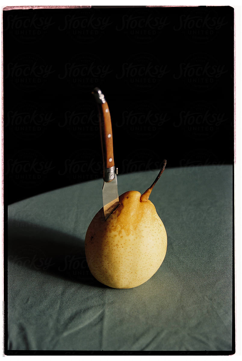 Pear and knife.