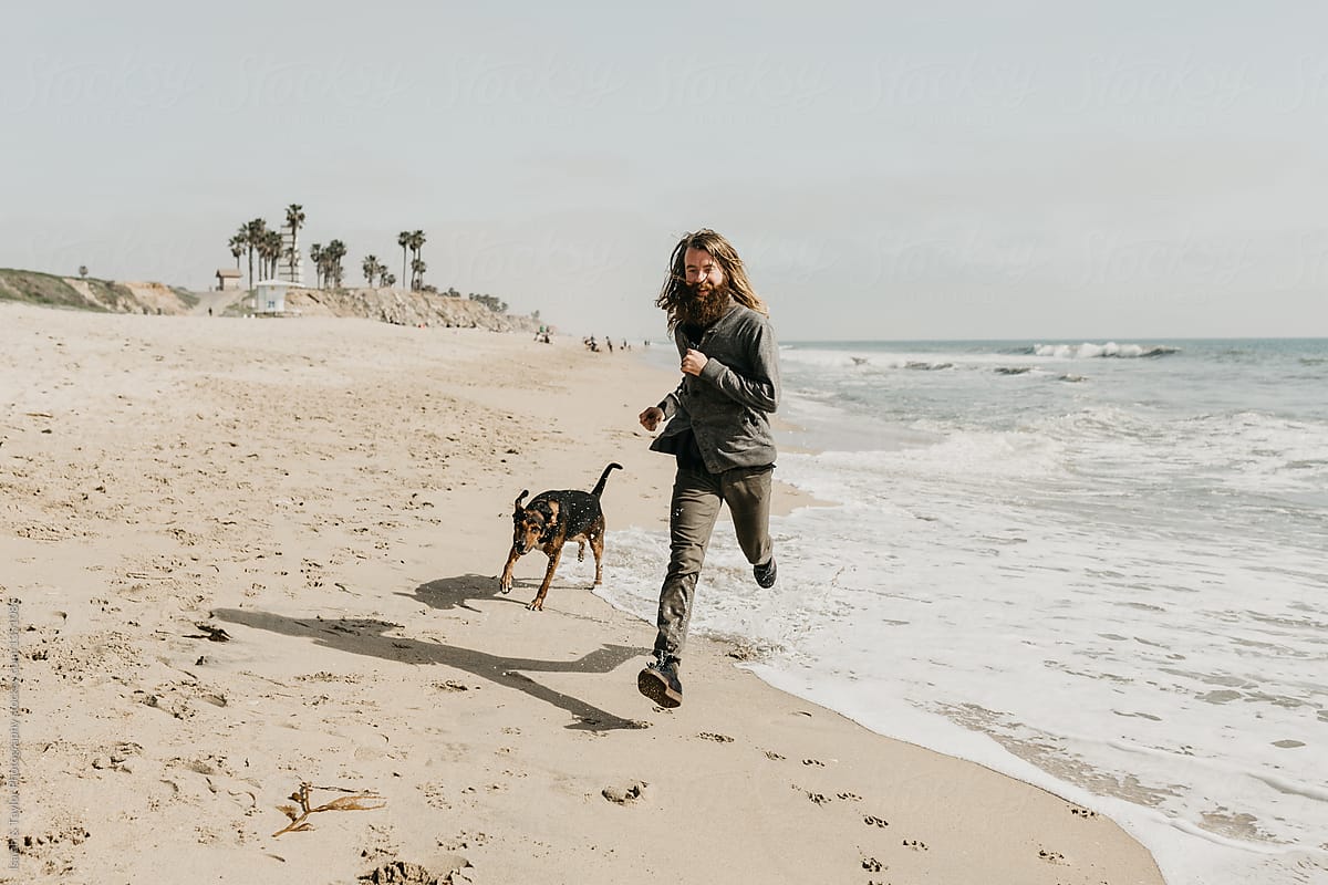 Man and dog at beach
