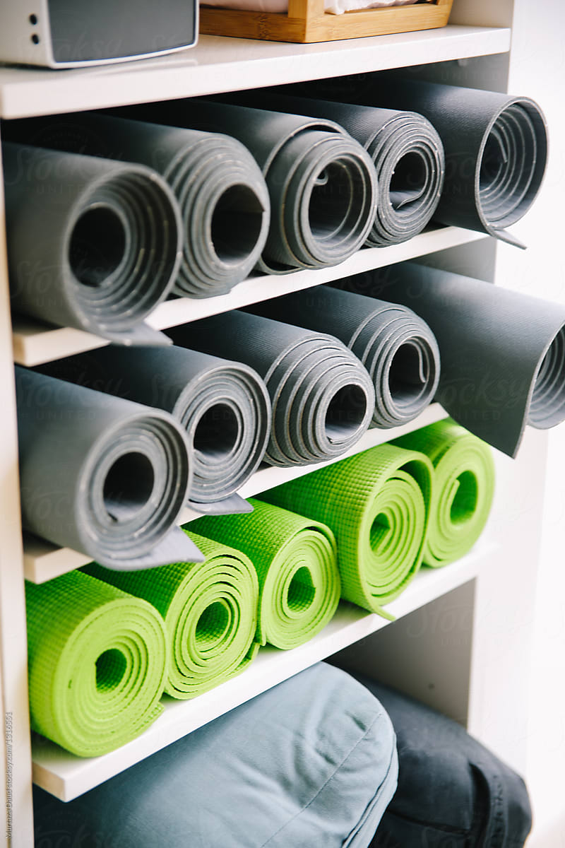 Mats And Yoga Accessories In A Yoga Studio by Stocksy Contributor Murtaza  Daud - Stocksy
