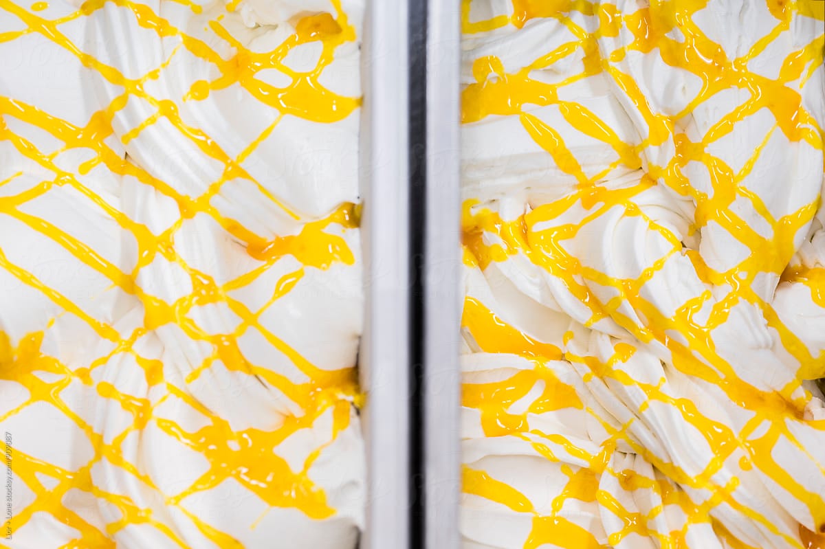 Closeup of vanilla ice cream with yellow sauce