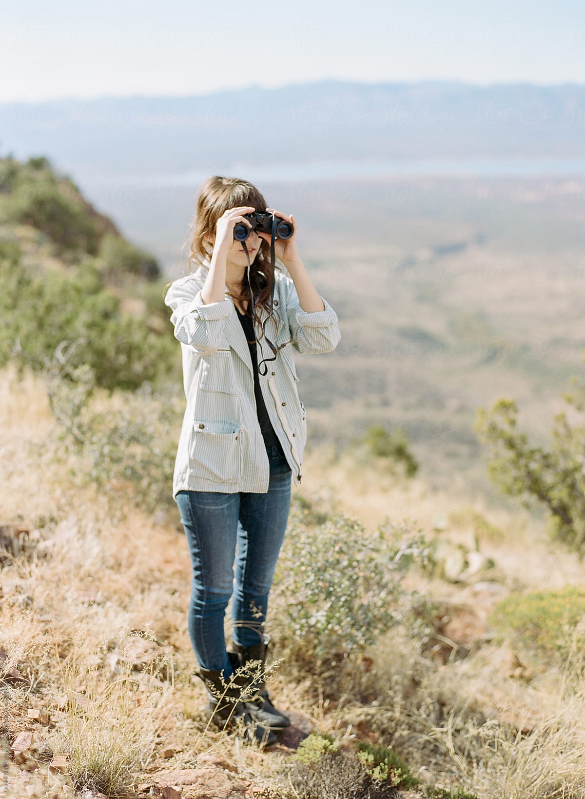 girl viewing with binoculars