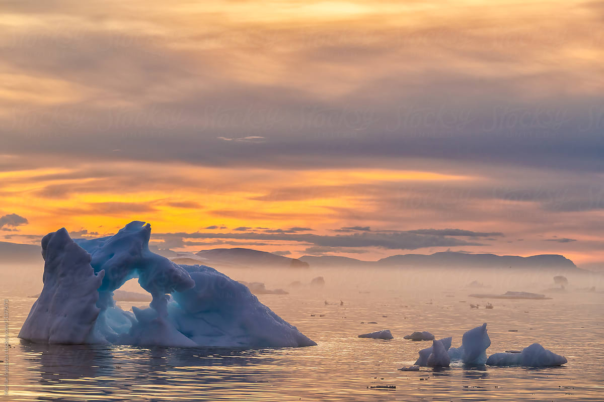 Misty Icebergs During Midnight Sun